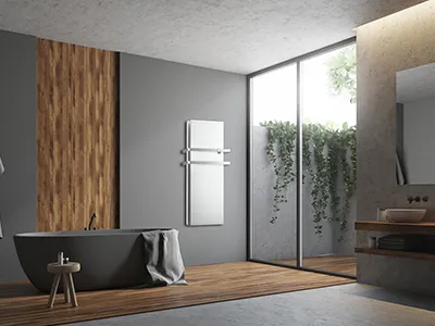 Radiatore ICON verticale DUAL-THERM  bianco da bagno con due barre portasalviette posizionato in bagno ultra moderno 