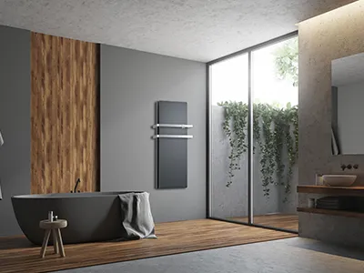 Radiatore ICON DUAL-THERM verticale antracite da bagno con due barre portasalviette posizionato in bagno ultra moderno 